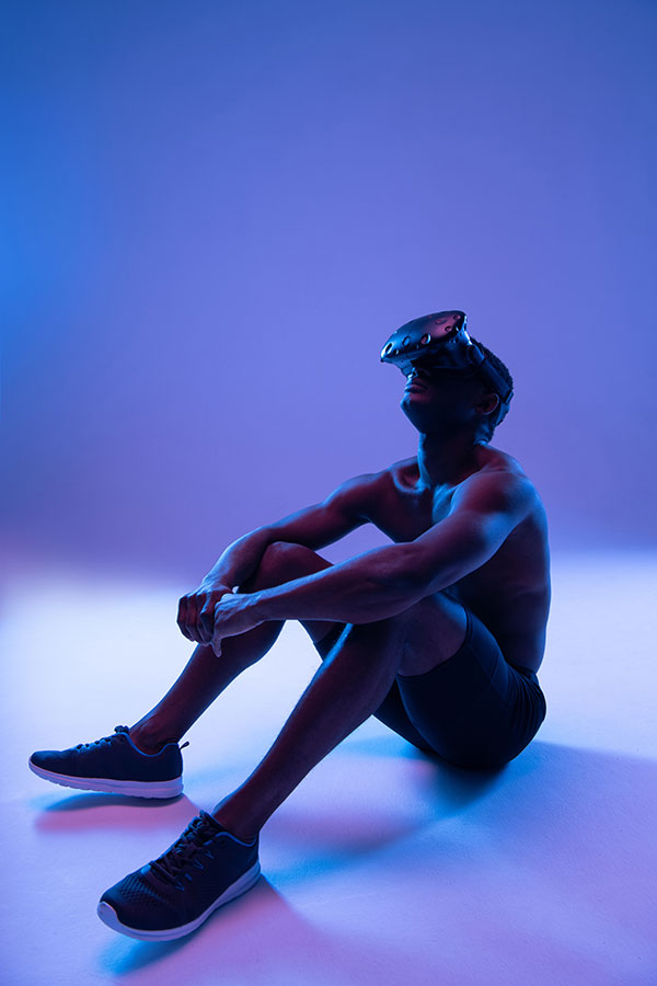 dreamy-ethnic-sportsman-exploring-virtual-reality